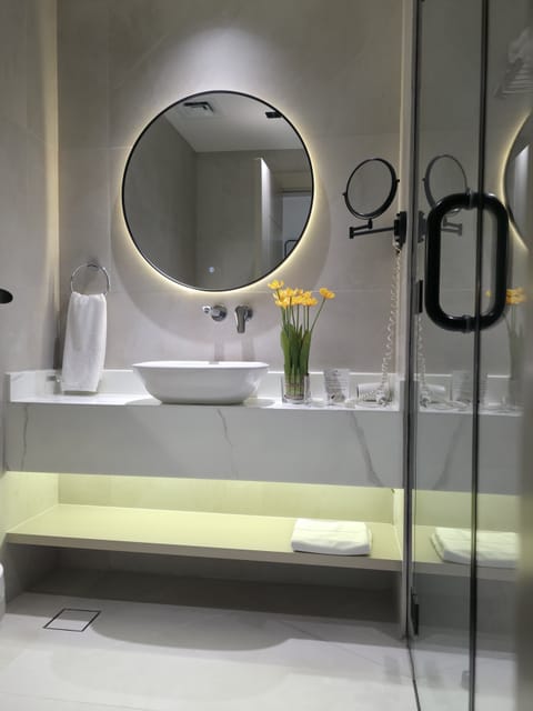 Premium Room, 1 King Bed | Bathroom | Combined shower/tub, deep soaking tub, eco-friendly toiletries