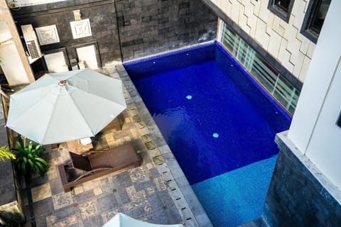 Outdoor pool, open 9:00 AM to 10:00 PM, pool umbrellas, sun loungers