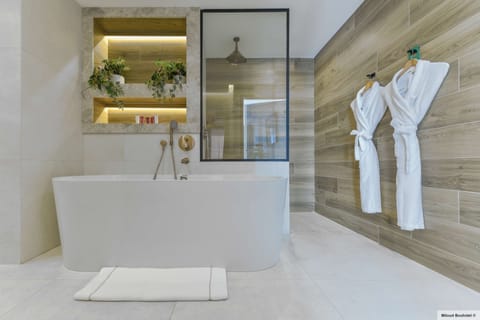 Designer toiletries, hair dryer, towels, soap