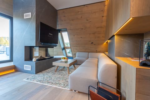 Presidential Studio Suite | Living area | 55-inch LCD TV with cable channels, TV, table tennis