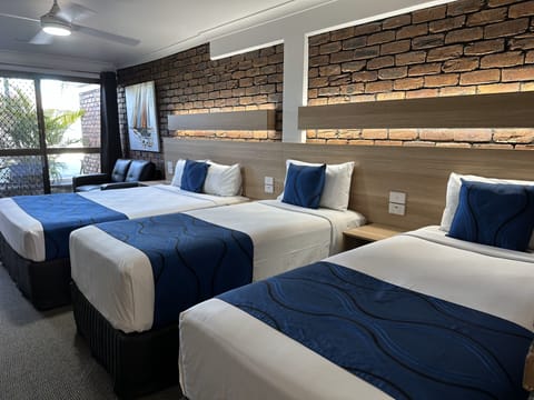 Family Room, Patio, Garden View (Family Suite) | Pillowtop beds, desk, blackout drapes, iron/ironing board
