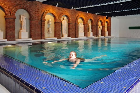 Indoor pool, pool umbrellas, sun loungers