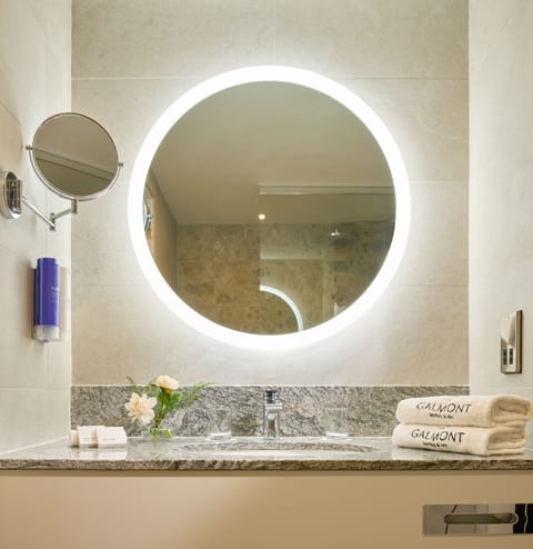 Combined shower/tub, designer toiletries, hair dryer, slippers