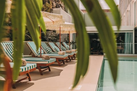 Indoor pool, outdoor pool, open 10:00 AM to 8:00 PM, pool umbrellas