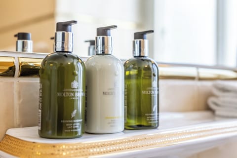 Designer toiletries, hair dryer, heated floors, towels