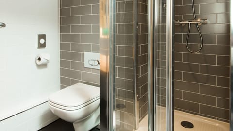 Shower, hair dryer, towels, shampoo