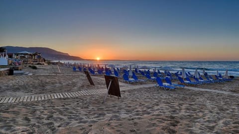 On the beach, sun loungers, beach umbrellas