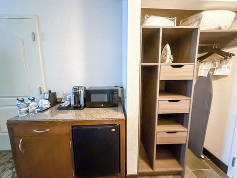 Desk, laptop workspace, iron/ironing board, free cribs/infant beds