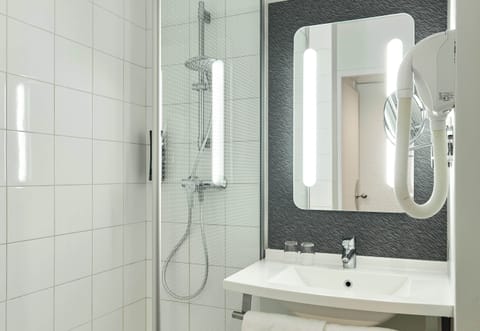 Shower, eco-friendly toiletries, hair dryer, towels