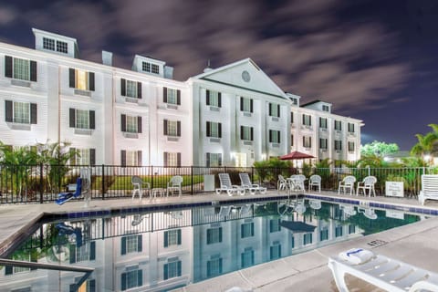 Outdoor pool, open 7:00 AM to 6:00 PM, pool umbrellas