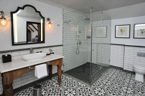 Separate tub and shower, rainfall showerhead, hair dryer, bathrobes