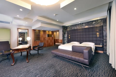 Senior Suite, 1 Bedroom, Balcony | Living room | Flat-screen TV