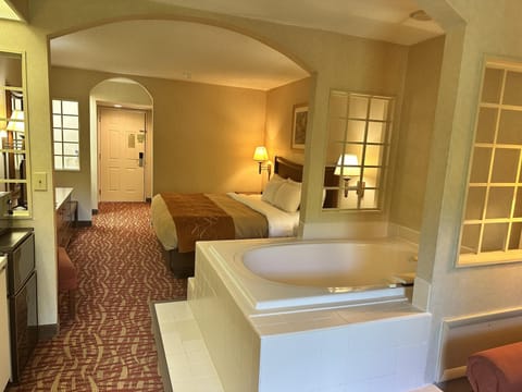 Suite, 1 King Bed, Jetted Tub, River View | Iron/ironing board, free WiFi, bed sheets