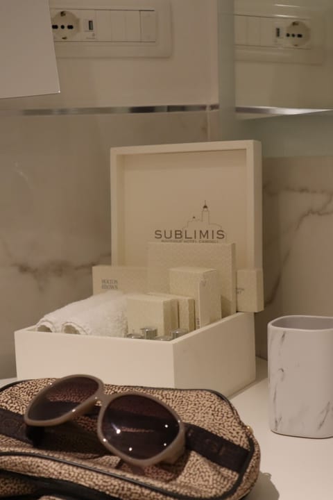 Designer toiletries, hair dryer, bathrobes, slippers