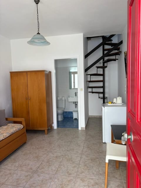 Maisonette by the pool side | Living area | Flat-screen TV