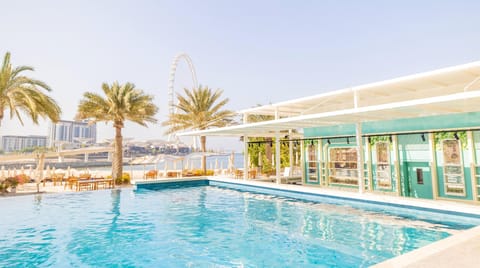 2 outdoor pools, open 9 AM to 9 PM, pool umbrellas, sun loungers