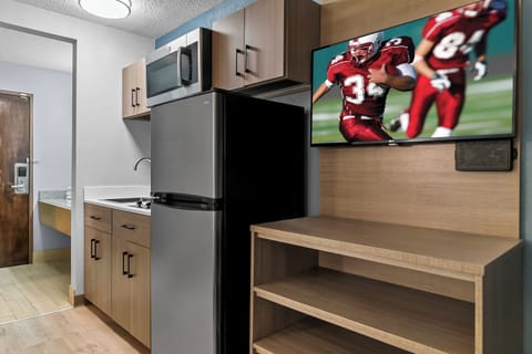 Studio, 1 King Bed, Non Smoking | Private kitchen | Full-size fridge, microwave, stovetop