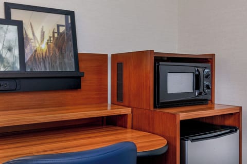 Desk, laptop workspace, iron/ironing board, travel crib