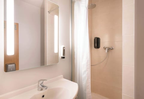 Shower, towels, soap, toilet paper