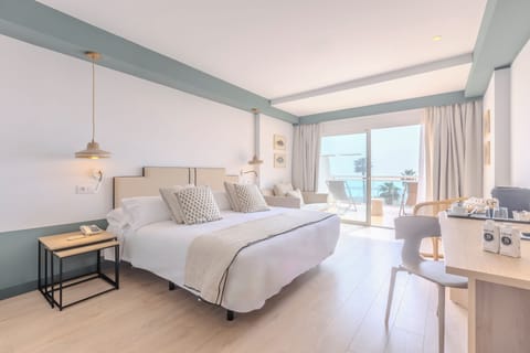 Triple Room, Balcony, Ocean View | Minibar, in-room safe, desk, blackout drapes