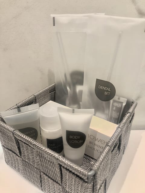 Shower, rainfall showerhead, designer toiletries, hair dryer