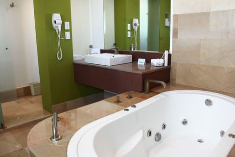 Suite, 1 King Bed | Bathroom | Separate tub and shower, hair dryer, towels