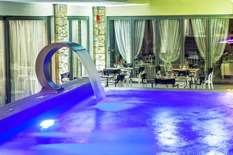 Outdoor pool, a waterfall pool, sun loungers