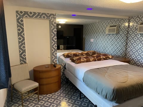 Economy Room, 1 Queen Bed | Down comforters, laptop workspace, blackout drapes, soundproofing