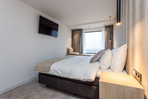 Premium bedding, down comforters, memory foam beds, minibar