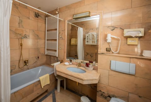 Bathtub, hair dryer, towels, soap