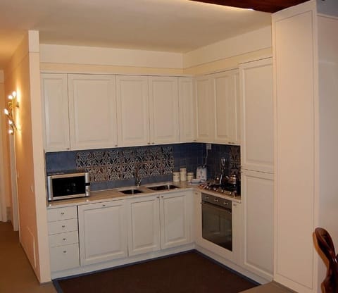 Deluxe Apartment, 2 Bedrooms | Private kitchen | Fridge, microwave, oven, coffee/tea maker