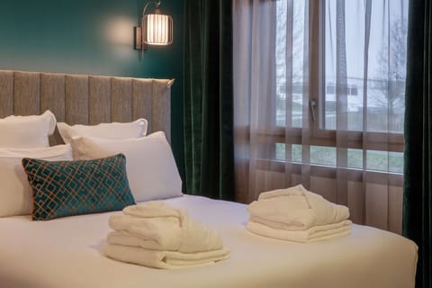 Premium bedding, pillowtop beds, in-room safe, individually furnished