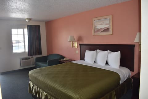 Economy Single Room, Non Smoking | Blackout drapes, iron/ironing board, free WiFi, bed sheets