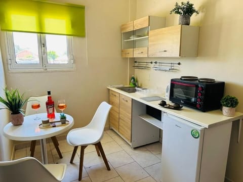 Mini-fridge, microwave, cookware/dishes/utensils