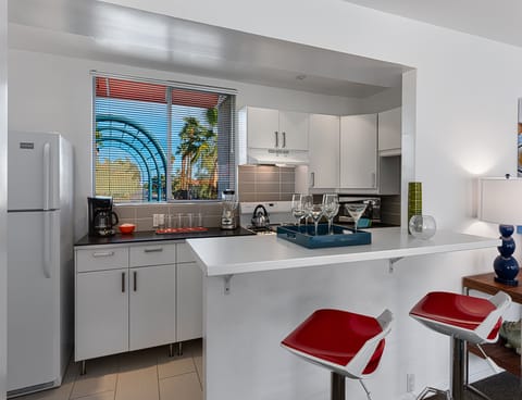 Deluxe Room, 1 King Bed | Private kitchen | Full-size fridge, oven, stovetop, espresso maker