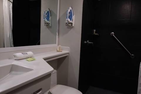 Deluxe Studio Suite | Bathroom | Shower, hair dryer, towels, soap