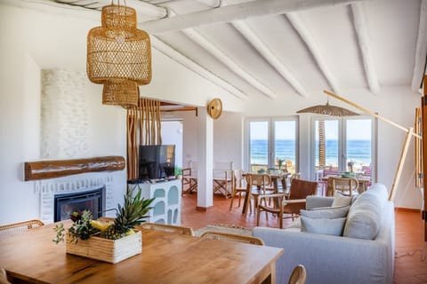 Panoramic Villa | Living area | 25-inch flat-screen TV with cable channels