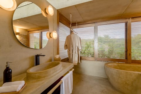Seafront Junior Suite | Bathroom | Shower, rainfall showerhead, hair dryer, bathrobes