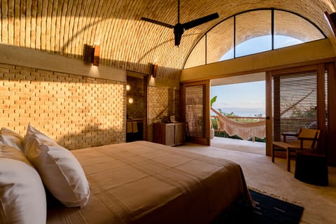 Seafront Senior Suite | Minibar, desk, laptop workspace, iron/ironing board