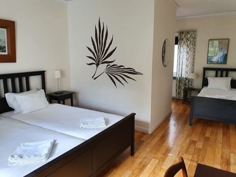Basic Triple Room | Blackout drapes, iron/ironing board (on request), WiFi (free)