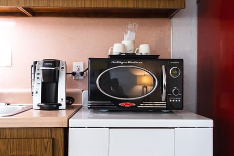 Family Suite, 1 Bedroom, Kitchen, Pool View | Private kitchen | Microwave, coffee/tea maker, cleaning supplies, paper towels