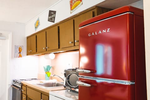 Family Suite, 1 Bedroom, Kitchen, Pool View | Private kitchen | Microwave, coffee/tea maker, cleaning supplies, paper towels