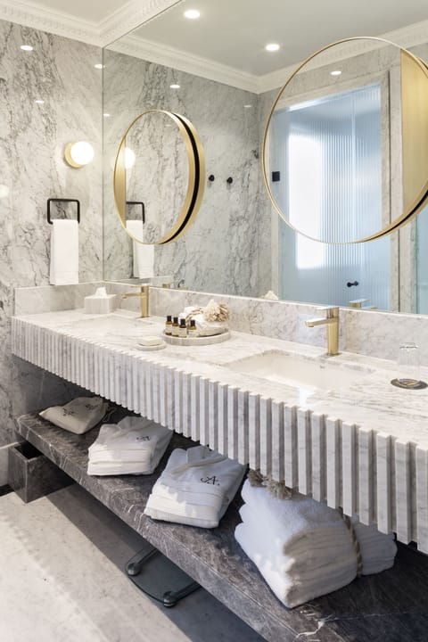 Designer toiletries, hair dryer, bathrobes, slippers