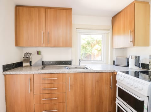 Fridge, electric kettle, toaster, cookware/dishes/utensils