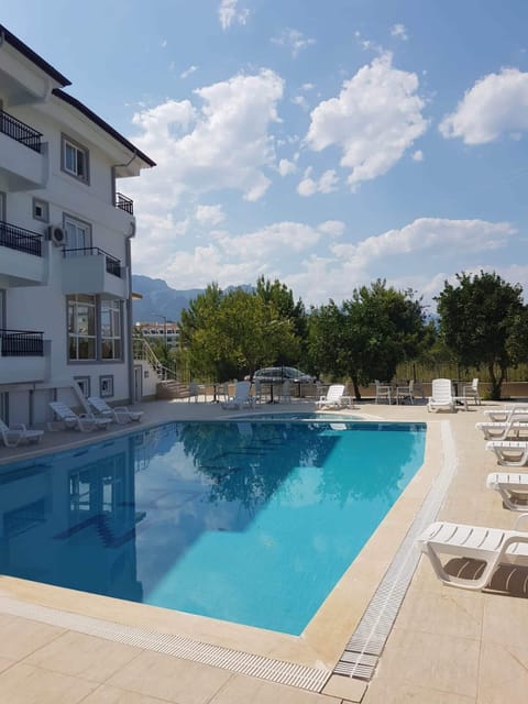 Seasonal outdoor pool, open 9:00 AM to 9:00 PM, pool umbrellas