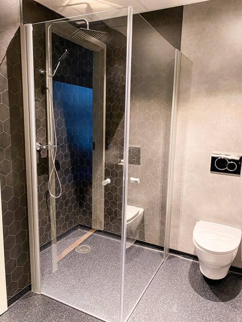 Panoramic Double Room | Bathroom | Shower, rainfall showerhead, hair dryer, heated floors