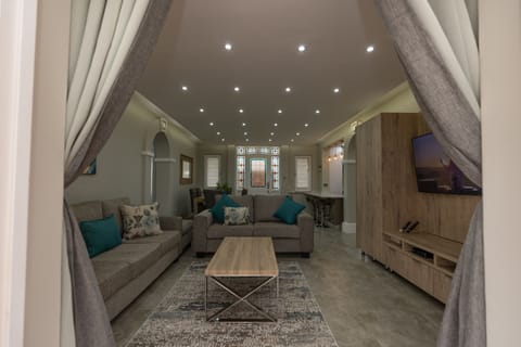 55-inch flat-screen TV with satellite channels, TV