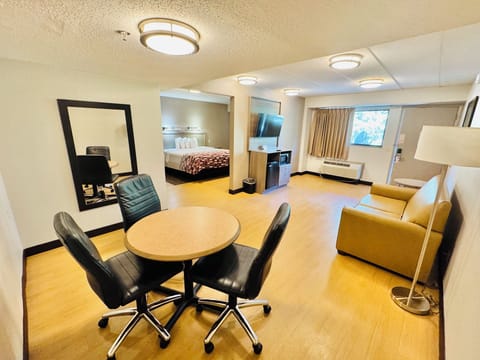 Suite, 1 King Bed with Sofa bed (Smoke Free) | Desk, laptop workspace, blackout drapes, free cribs/infant beds