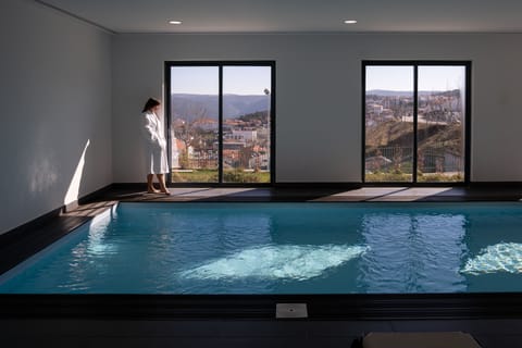 Indoor pool, seasonal outdoor pool, pool umbrellas, sun loungers