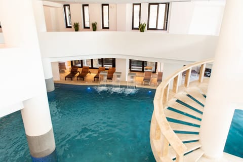 Indoor pool, seasonal outdoor pool, pool umbrellas, sun loungers